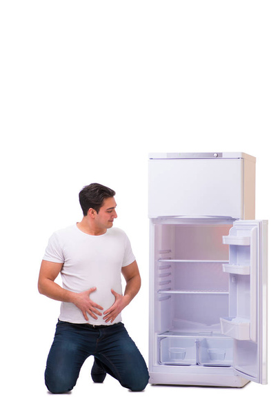 空の冷蔵庫の食品を探している人 - 写真・画像