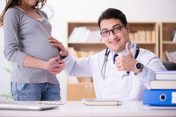Pregnant woman visiting doctor for consultation - Photo, image