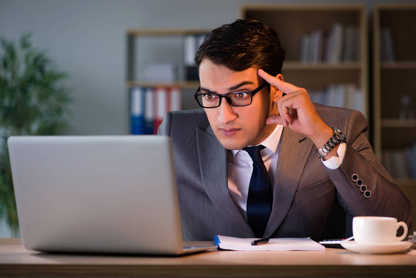 Businessman staying in the office for long hours - Photo, Image