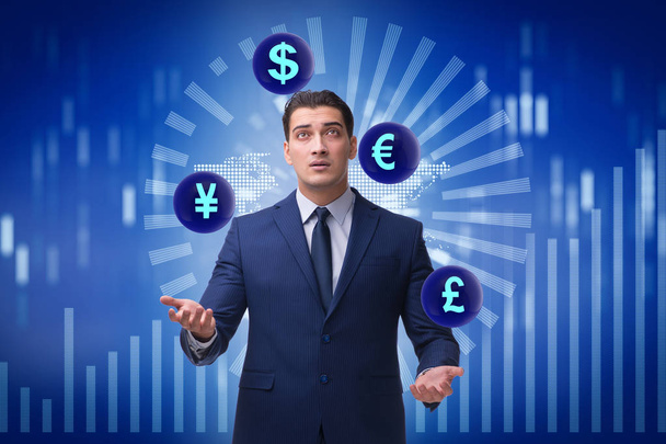 Businessman juggling between various currencies - Foto, afbeelding