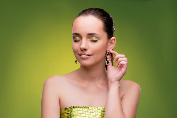 Young woman in beauty concept on green background - Photo, Image