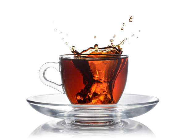 Splash in glass cup of black tea with ice - Photo, Image