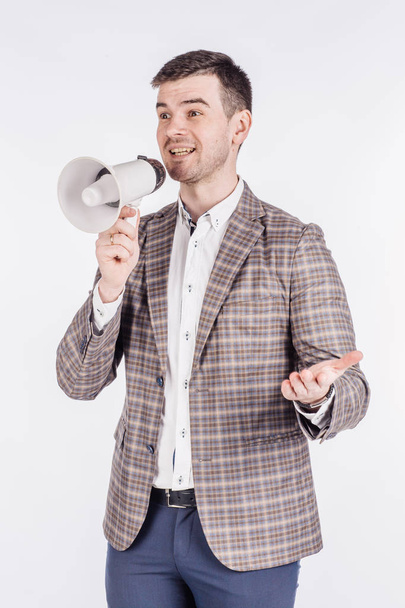 man holding megaphone. human emotion expression and lifestyle concept. image on a white studio background. - Zdjęcie, obraz