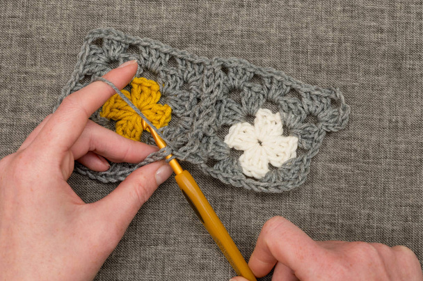 Knitting Patch of Crocheted Fabric with Flower Design - Photo, Image