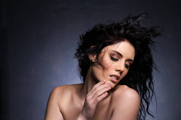 Beautiful brunette model in a studio  - Valokuva, kuva