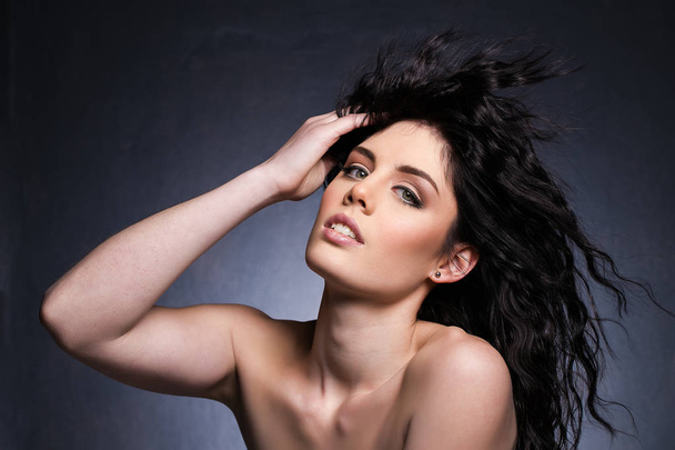 Beautiful brunette model in a studio  - Foto, Imagen
