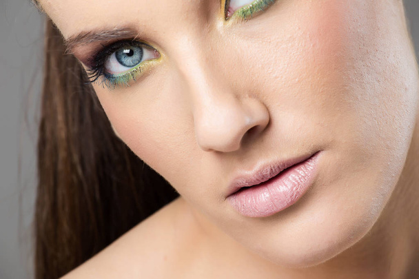 Head shot of a female model wearing birght make-up - Photo, image