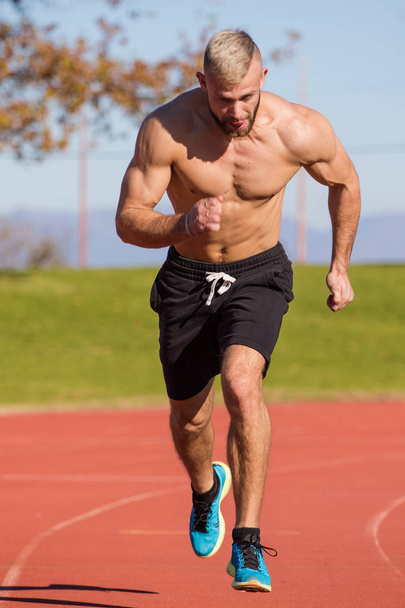 Male Athlete sprinting  - Foto, imagen