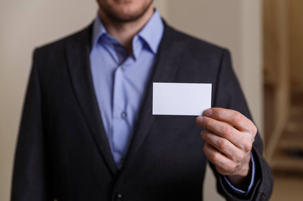 Businessman holding visit or business card. - Foto, Imagen
