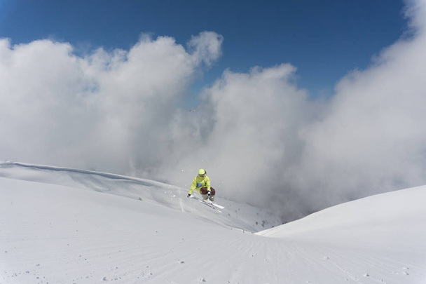 Ski rider jumping on mountains. Extreme freeride sport. - Zdjęcie, obraz