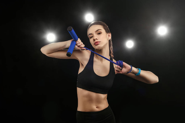 Sporty woman with skipping rope  - Foto, Bild