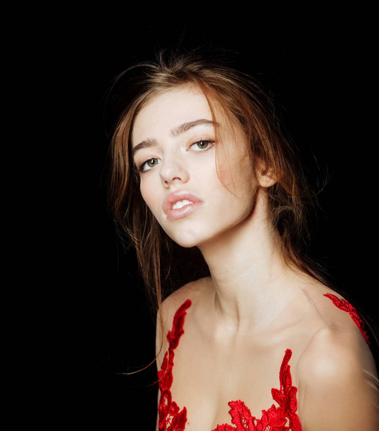 pretty sexy woman with long hair in red embroidered bodysuit - 写真・画像