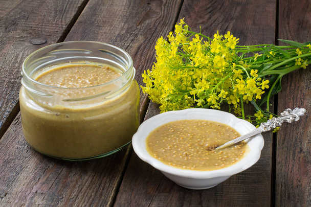 Homemade mustard grains and mustard flowers  - Photo, Image