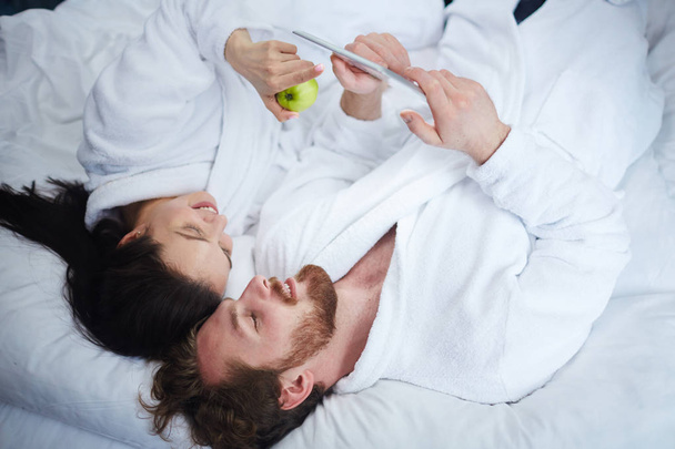 Modern couple in bathrobes - Photo, Image