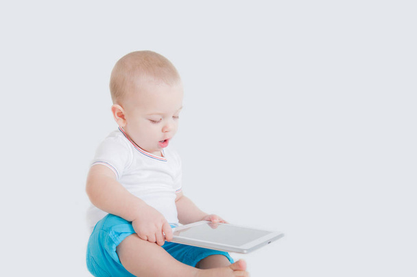 one year old baby playing on tablet  - Foto, Imagem