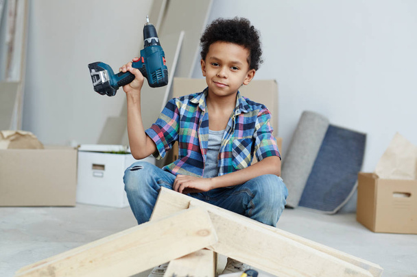 Youngster with electric drill - Photo, Image