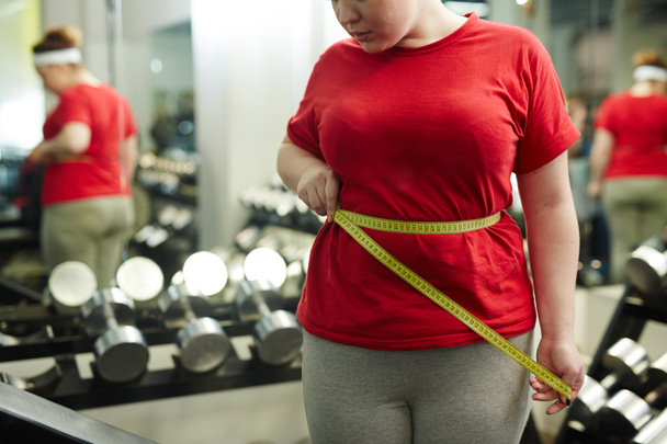 Woman measuring waist size  - Photo, Image