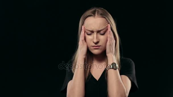 Beautiful woman with headache touching her temples - Footage, Video