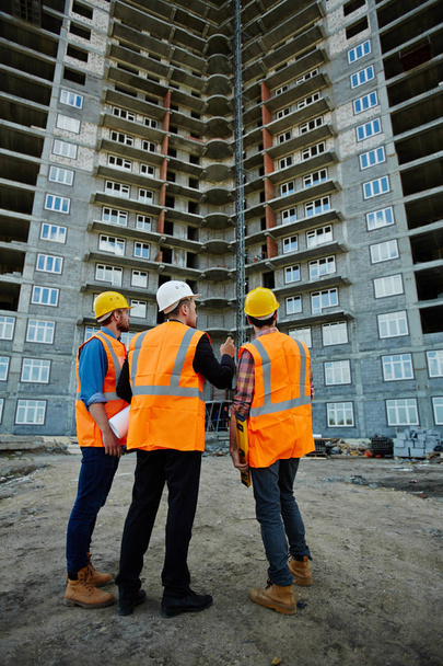 three workmen wearing reflective vests - Photo, Image