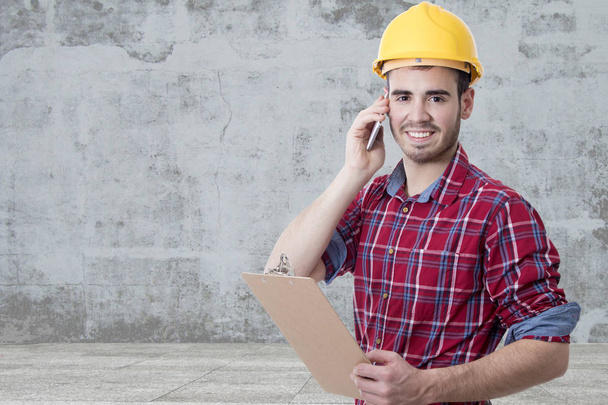 builder with smartphone - Photo, image