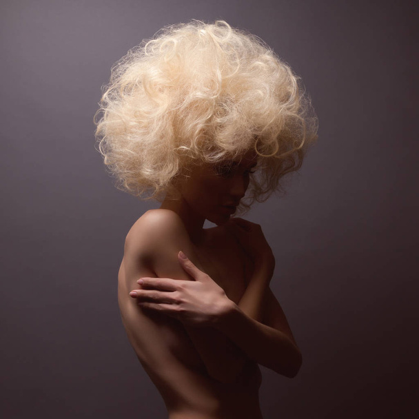 Portrait of young woman with beautiful bushy hair - Zdjęcie, obraz