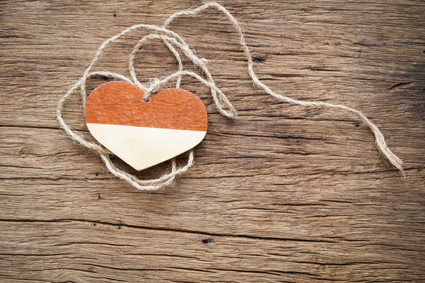 wooden heart with rope on old wooden - Photo, Image