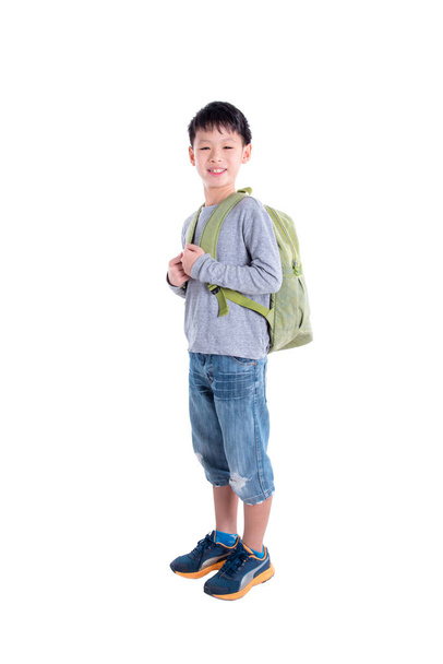 Young asian boy with backpack over white background - Photo, Image