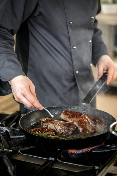Chef frying pork meat - Foto, immagini