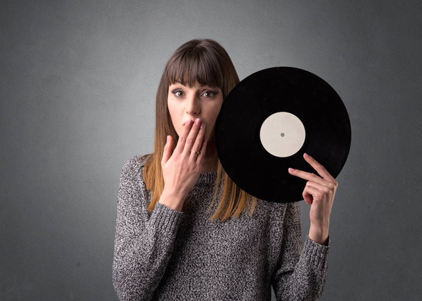 Lady holding vinyl record - Foto, immagini