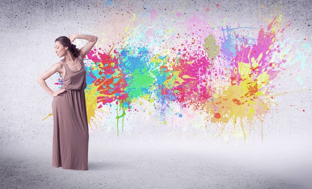 Modern street dancer jumping with colorful paint splashes - Foto, Bild