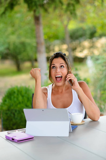 Successful casual woman with laptop outside - Photo, Image