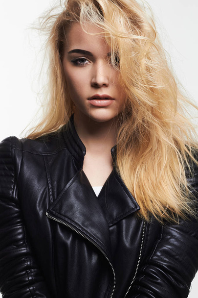 beautiful blond girl in leather coat - Fotografie, Obrázek