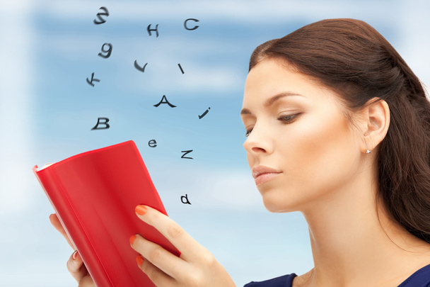 Calm and serious woman with book - Foto, Imagem
