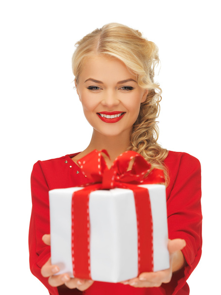Lovely woman in red dress with present - Foto, afbeelding
