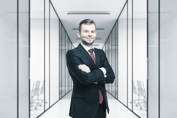 Confident man in an office lobby - Foto, afbeelding