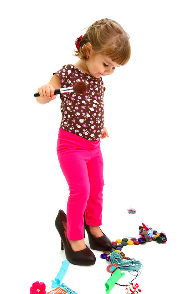 Little girl and big shoes isolated on white background - Fotoğraf, Görsel