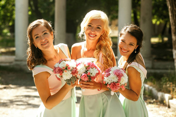 beautiful bridesmaids with bouquets  - Фото, зображення