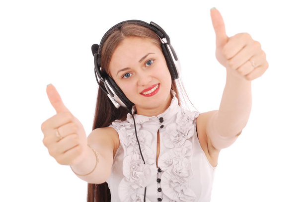 Pretty teenage girl listening music on her headphones  - Foto, Bild