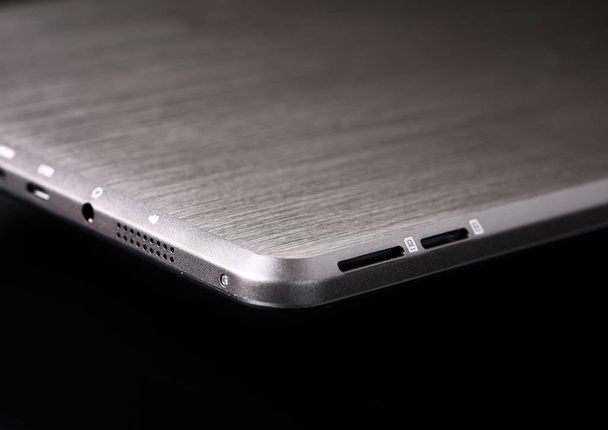 Tablet white silver metal on black background horizontal back de - Φωτογραφία, εικόνα