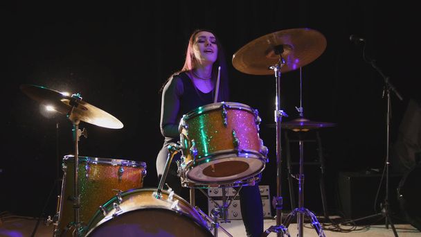 Teen rock music - attractive girl percussion drummer perform music break down - Photo, Image