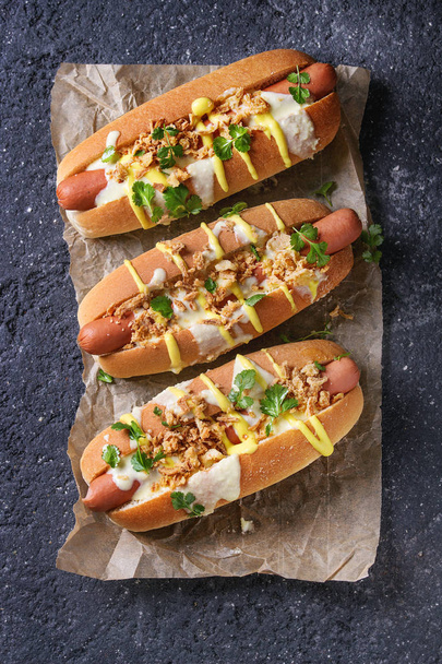 Hot dogs with cheese sauce and mustard - Fotoğraf, Görsel