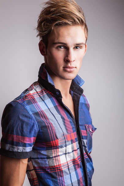 Elegant young handsome man. Studio fashion portrait on bright background. - Foto, Imagen