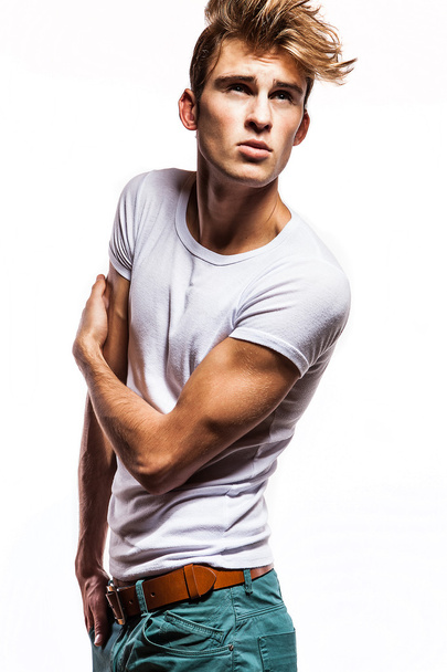 Attractive man wearing T-shirt close up portrait on white background. - 写真・画像