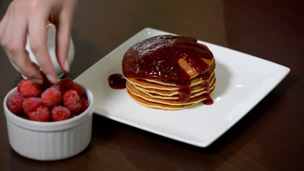 Pancake decorated with raspberries. American pancakes with raspberry jam. - Footage, Video