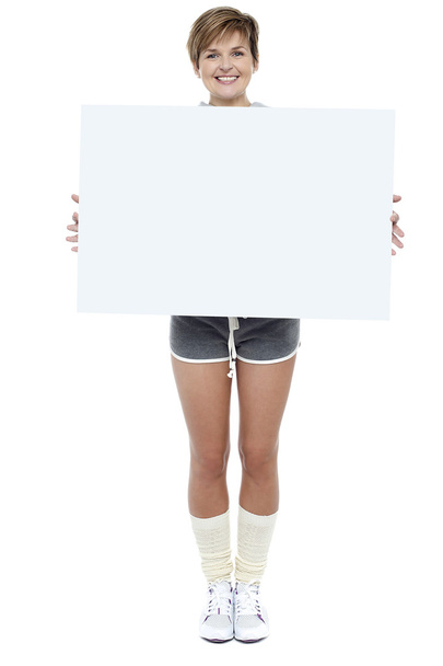 Pretty woman presenting blank whiteboard - Zdjęcie, obraz