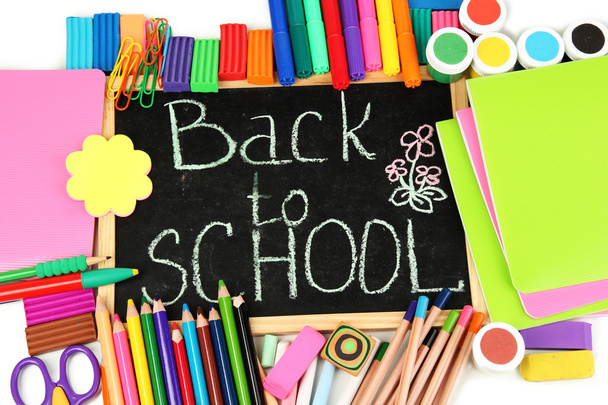 The words 'Back to School' written in chalk on the small school desk with various school supplies close-up - Foto, Imagem