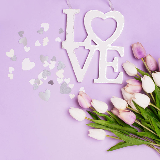 Fresh tulip flowers and heart on pink background. Top view with  - Valokuva, kuva
