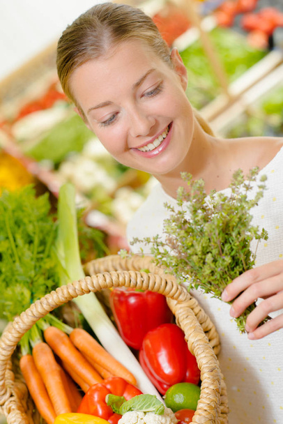 Woman with a lovely selection of vegetables - Foto, Imagen