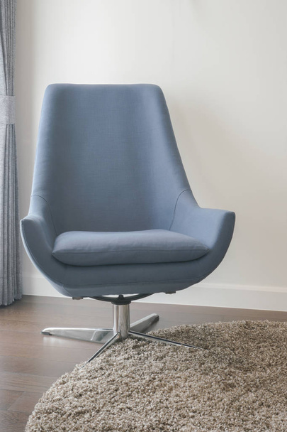 Indigo modern style armchair on area rug in living room - Photo, image