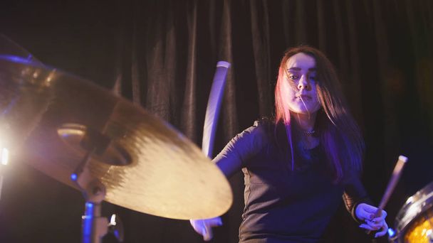 Teen rock music - gothic girl percussion drummer performing with drums - Photo, image